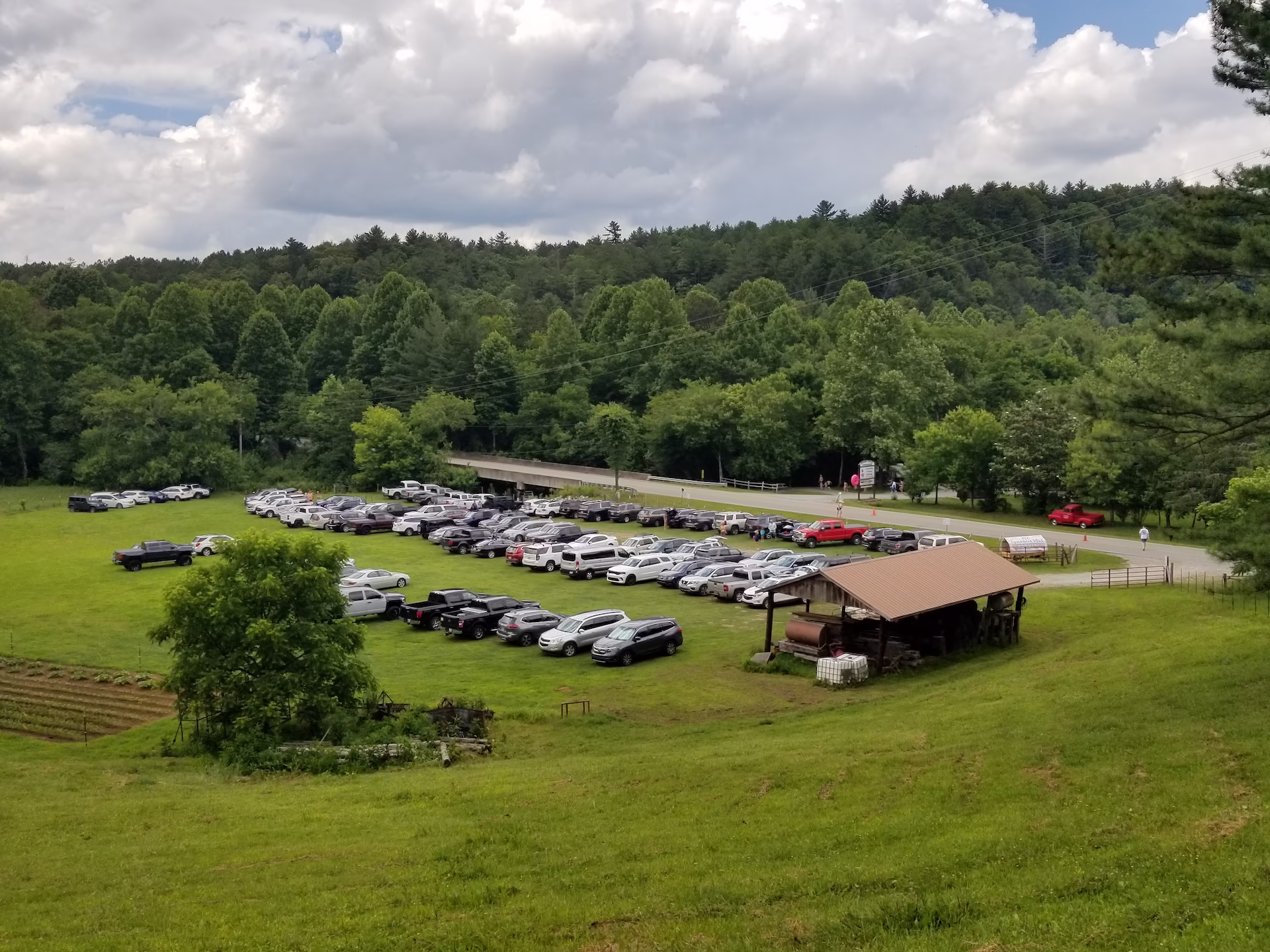 20210626_142847 Parking lot of Toccoa Valley Campground filled with cars.